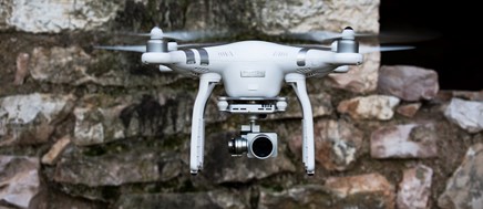 How have drones impacted building surveying?